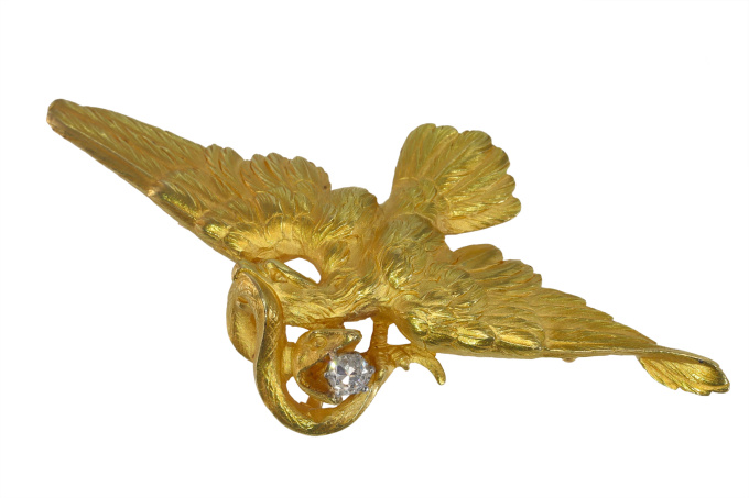Vintage French antique brooch/pendant flying eagle fighting a snake holding a diamond in its beak by Artista Sconosciuto