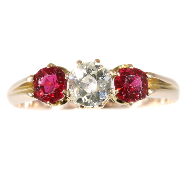 Antique ring with old mine brilliant cut diamond and two red strass stones by Artista Sconosciuto