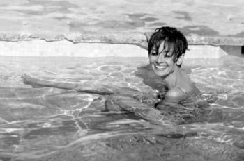 Audrey Hepburn in a pool in St Tropez. by Terry O'Neill