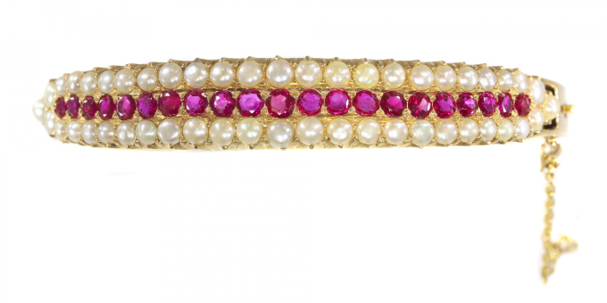 Vintage antique gold bangle with natural rubies and pearls sold by Simons Jewellers The Hague & Amsterdam by Unknown artist