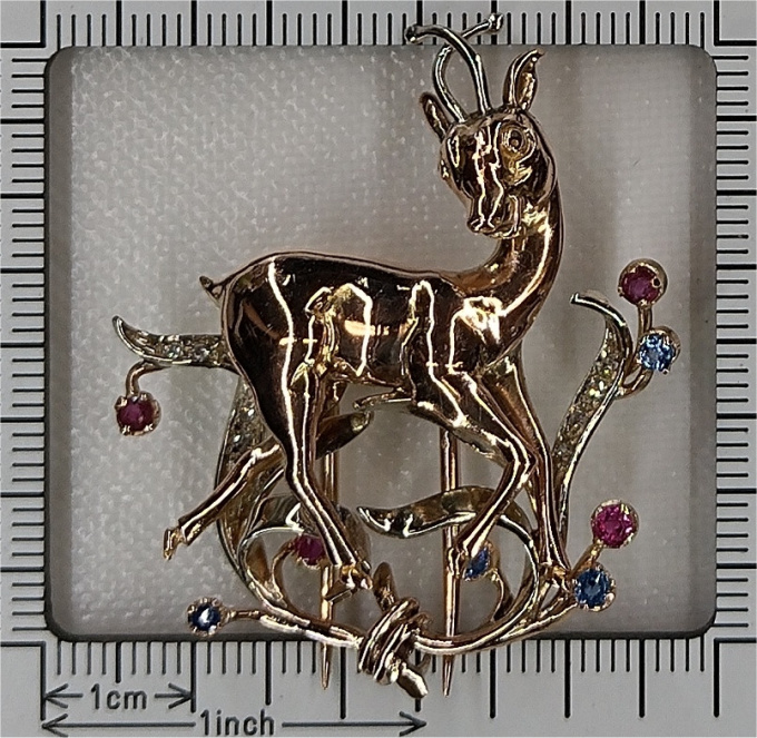 Vintage gold diamonds rubies and sapphires Bambi brooch by Unknown Artist