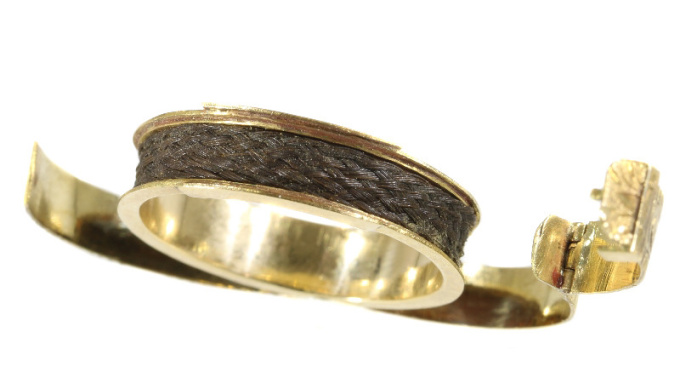 Gold antique ring with hidden space and woven hair by Unknown Artist