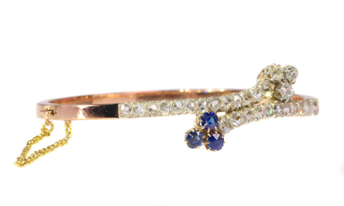 Victorian diamond and sapphire cross over bangle by Onbekende Kunstenaar