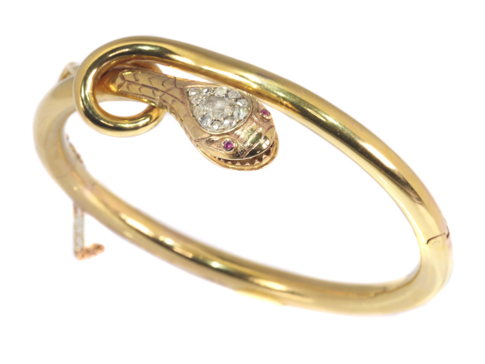 Antique snake bangle set with diamonds and rubies by Artista Desconocido