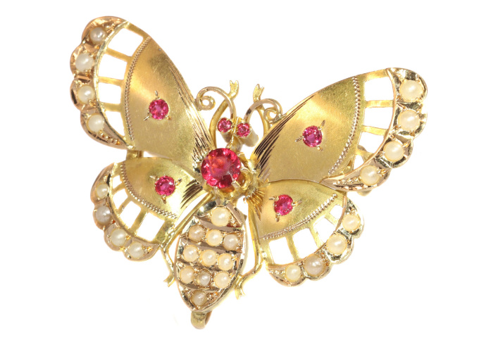 Late Victorian gold butterfly with red strass stones and half seed pearls by Unknown Artist