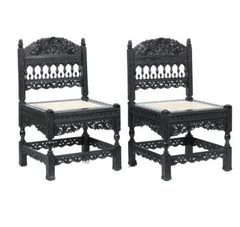 An extraordinary pair of Indian ebony low chairs formerly owned by the Duke of Westminster Coromandel coast, possibly Madras, 1680-1700 by Artista Sconosciuto