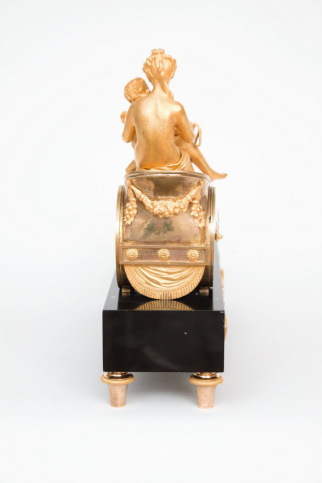 A French empire ormolu and marble chariot mantel clock, circa 1800 by Onbekende Kunstenaar