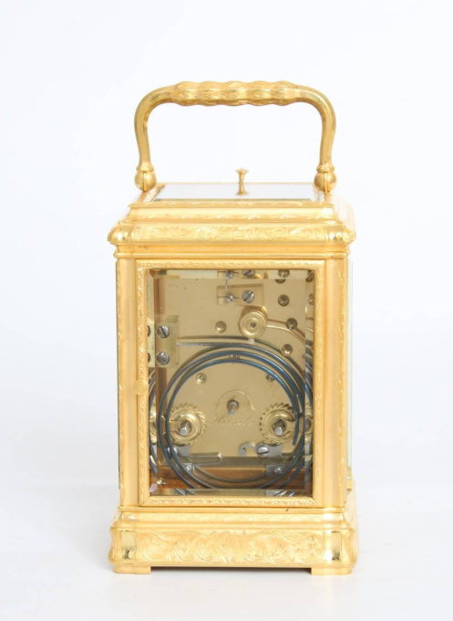 A French engraved gilt brass gorge case carriage clock, circa 1870 by Onbekende Kunstenaar