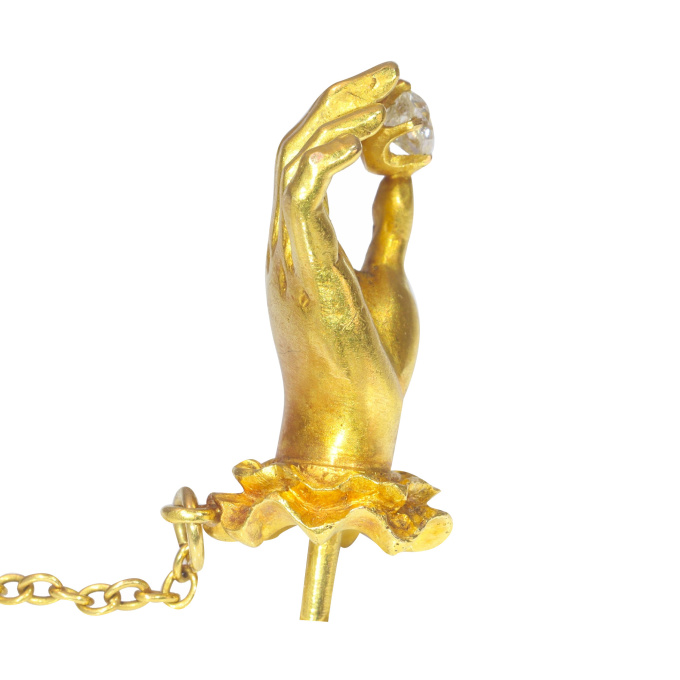 Antique 18K yellow gold tiepin hand holding an old mine cut diamond by Artista Sconosciuto
