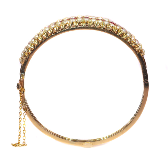 Vintage antique gold bangle with natural pearls and rubies sold by Simons Jewellers The Hague & Amsterdam by Unknown artist