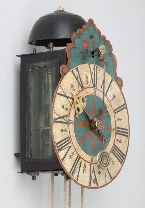 A South German polychrome wall clock, circa 1710 by Artista Sconosciuto
