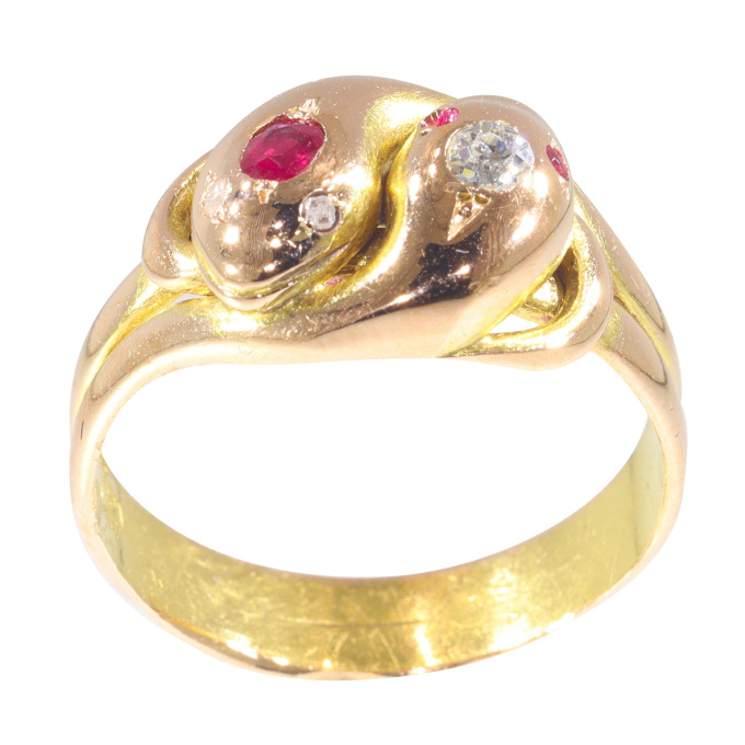 Vintage antique 18K gold double snake ring set with diamonds and rubies by Unknown artist