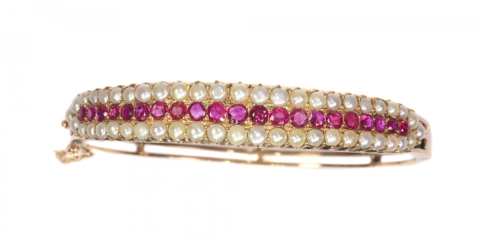 Vintage antique gold bangle with natural pearls and rubies sold by Simons Jewellers The Hague & Amsterdam by Unknown artist