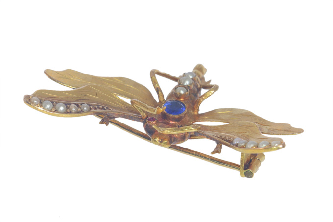 Vintage antique Victorian insect brooch with half seed pearls and a blue stone by Unknown artist