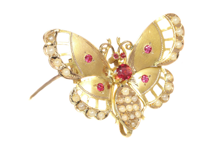 Late Victorian gold butterfly with red strass stones and half seed pearls by Unknown Artist