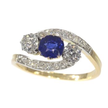 Vintage Belle Epoque cross over ring with brilliant cut diamonds and high quality natural sapphire by Artista Desconocido