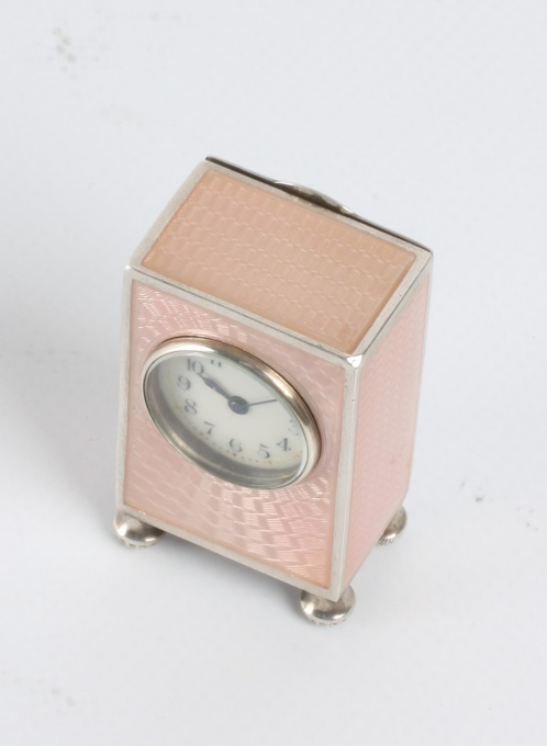 A miniature Swiss silver guilloche enamel timepiece, circa 1900 by Artista Desconhecido