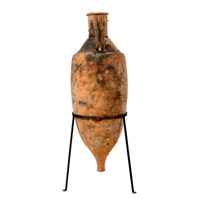  A Roman shipwrecked terracotta wine transport amphora by Onbekende Kunstenaar