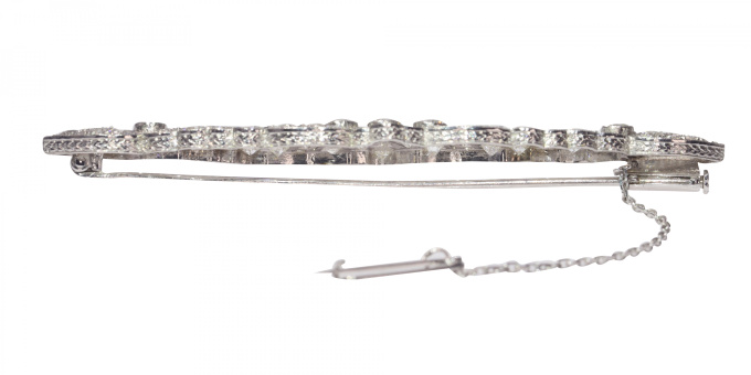 Vintage platinum Art Deco diamond brooch with sapphire accents by Artista Sconosciuto