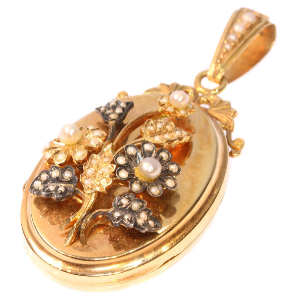 Victorian rose gold locket with seed pearl set bouquet of flowers on top by Artiste Inconnu